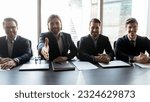Small photo of Wide banner panoramic view of smiling male employers sit at desk stretch hand meet new employee into team. Happy successful businessmen welcome newcomer or newbie. Success, employment concept.
