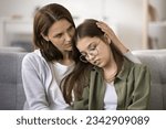 Small photo of Concerned mother hugging upset teenager daughter child at home. Mom giving family support, empathy, comfort to teen girl in eye glasses sharing problems, failure, bad troubles