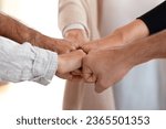 Small photo of Close up of people fist bumping put hands together makes circle shape, loyalty, contribution symbol. Friendship support in business, common project aspiration intention take leading position concept