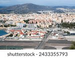 Small photo of Gibraltar aerial view. Airport runaway crossing road. Top view on La Linea De La Concepcion.