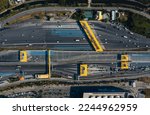 Small photo of Aerial top view of Cars passing through the Automatic Point of Payment on motorway Toll Road. Point of toll highway, Toll Station. Highway toll plaza or Turnpike or Charging point, Expressway
