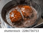 Small photo of Hamburg steak and meatballs made in a cast iron skillet