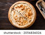 Small photo of classic Ossetian pie with filling, homemade dietary ossetian pie with cabbage and brisket. National pastries Ossetian pies with different fillings
