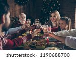Noel evening family gathering, meeting, congrats. Cheerful grey-haired grandparents, grandchildren, daughter, son, relatives sitting at table, house party, navidad, eating dinner homemade food fun