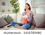 Small photo of Poprtarit of cute funny funky lady sit divan legs crossed folded laughter content cheerful funny funky serials sitcoms wavy curly hairdo shirt checkered plaid jeans apartment