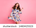 Nice lady overjoyed by warm spring breeze going romantic date wear cute dress isolated pink background