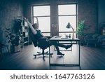 Small photo of Profile side view of his he nice attractive classy chic gray-haired man economist top executive manager sitting in chair stretching at modern loft industrial style interior work place station indoors