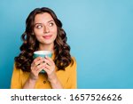 Close-up portrait of her she nice attractive cheery dreamy curious feminine wavy-haired girl holding in hands drinking latte isolated on bight vivid shine vibrant green blue turquoise color background
