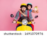 Portrait of his he her she nice attractive worried amazed couple driving moped hurry-up rush holding in hands clock pout lips omg isolated over pink pastel color background