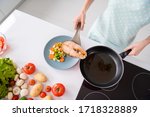 Small photo of High angle view cropped photo of housewife lady put grilled salmon fillet steak flying pan ready roasted on plate with garnish cooking dinner wear apron t-shirt stand modern kitchen indoors
