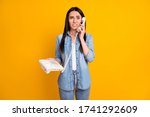 Small photo of Portrait of her she nice-looking attractive pretty confused brunet girl calling dialing friend wrong number isolated on bright vivid shine vibrant yellow color background