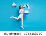 Full length body size view of her she nice attractive cheerful cheery girl maid jumping holding in hand laundry bowl throwing things isolated on bright vivid shine vibrant blue color background