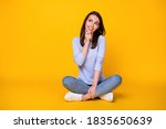 Portrait of her she nice attractive brainy smart clever cheerful girl sitting, lotus position thinking making decision copy space clue guess isolated bright vivid shine vibrant yellow color background