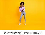 Full size portrait of nice dark skin person look empty space enjoy dancing wear purple isolated on yellow color background