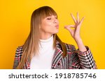 Photo of adorable person closed eyes arm fingers show gourmet gesture isolated on yellow color background