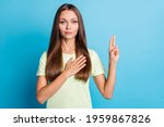 Small photo of Photo of young attractive woman confident serious hand on chest make promise oath swear isolated over blue color background