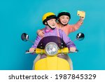Small photo of Photo of grey haired retired pensioner husband wife couple people wear helmet rider make selfie isolated on blue color background