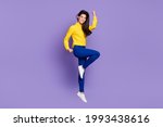 Small photo of Full body profile side photo of triumphant young woman raise fists win jump up air isolated on violet color background