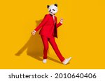 Small photo of Photo of freak panda guy enjoy funky discotheque motion wear mask red tuxedo shoes isolated on yellow color background