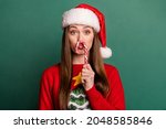 Photo of young woman plump lips fooling candy sweet christmas spirit isolated over green color background