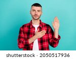 Small photo of Photo of serious young calm honest man hold hand chest heart make oath pledge isolated on teal color background