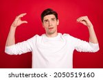 Small photo of Photo of unsure brunet young guy blah blah wear white shirt isolated on red color background