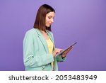 Profile portrait of charming positive person hold use tablet chatting social network isolated on purple color background