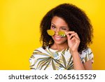 Small photo of Photo of young pretty afro girl coquettish wink eye hand touch glasses isolated over yellow color background