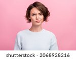 Photo of unhappy young woman bad mood irritated problem raise eyebrow isolated on pink color background