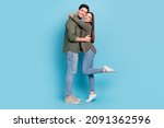 Full length photo of married couple lady cuddle guy soulmate isolated over sky light color background