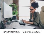 Small photo of Profile side view portrait of attractive focused girl technician texting using device app remote support at workplace workstation indoors