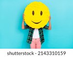 Small photo of Photo of anonymous incognito lady hold emoji smile cover face wear plaid shirt isolated teal color background