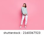 Small photo of Full body photo of young pretty lady wonder look empty space modern outfit isolated over pink color background