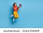 Full body profile side photo of young lady type laptop workshop marketer jumper isolated over blue color background