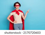 Small photo of Photo of pretty sweet lady dressed red mantle pointing finger empty space isolated blue color background