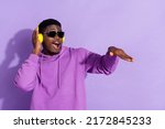 Small photo of Portrait of attractive cheerful funny guy listening bass soul jazz having fun isolated over bright violet lilac color background