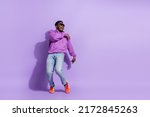 Small photo of Full body photo of excited positive man rejoice clubbing spend pastime isolated on purple color background