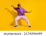 Small photo of Full length body size view of attractive cheerful guy fooling dancing clubbing isolated over bright yellow color background