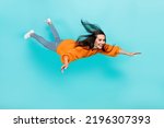 Full length photo of pretty satisfied person fly falling toothy smile isolated on teal color background
