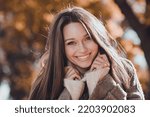 Small photo of Close up portrait of nice positive lady dressed trendy comfortable cozy modern outfit overcoat sunshine day outdoors
