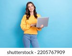Small photo of Photo of young positive pretty nice gorgeous girl businesswoman hold computer programmer toothy smile successful isolated on blue color background