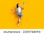Small photo of Full size portrait of excited crazy lady hold telephone make selfie have good mood isolated on yellow color background