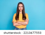 Photo of unsatisfied lady orange outfit bad mood negative reaction stand empty space clothes isolated on blue color background