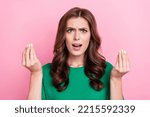Small photo of Photo of unsatisfied aggressive pretty woman show fingers ask why lost cash money bankrupt bad mood isolated on pink color background