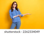 Small photo of Photo of adorable sweet woman dressed blue blouse eyewear inciting arms empty space isolated yellow color background