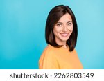 Portrait of gorgeous positive toothy beaming girl with straight hairstyle yellow t-shirt bright smiling isolated on blue color background