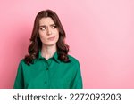 Small photo of Portrait of minded pensive agent lady look interested empty space hesitate isolated on pink color background