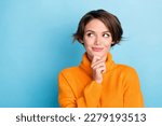 Portrait of creative gorgeous person arm touch chin look empty space brainstorming isolated on blue color background
