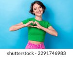 Small photo of Portrait of young cheerful young lady bob brown hair show love symbol sympathy heart shape stylish t-shirt isolated on blue color background