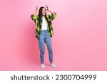 Full length photo of impressed scared lady wear checkered jacket rising arms hand looking empty space isolated pink color background